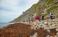 The fossils hunters at the coastline of Monmouth Beach at the Chippel Bay. West Dorset. England